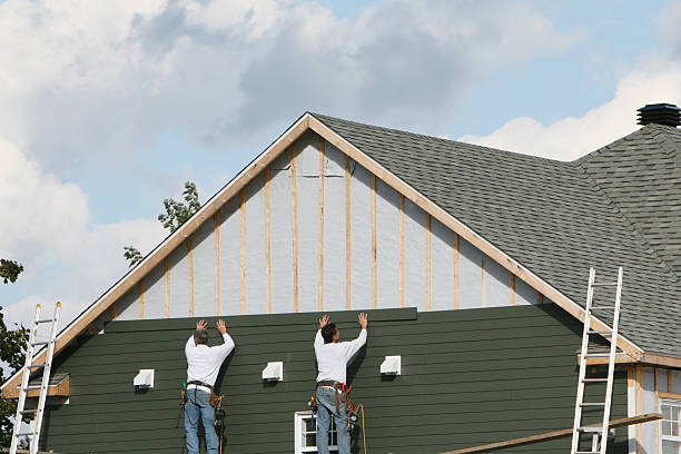 Professional Siding Installation technician working in Manitou Springs, CO